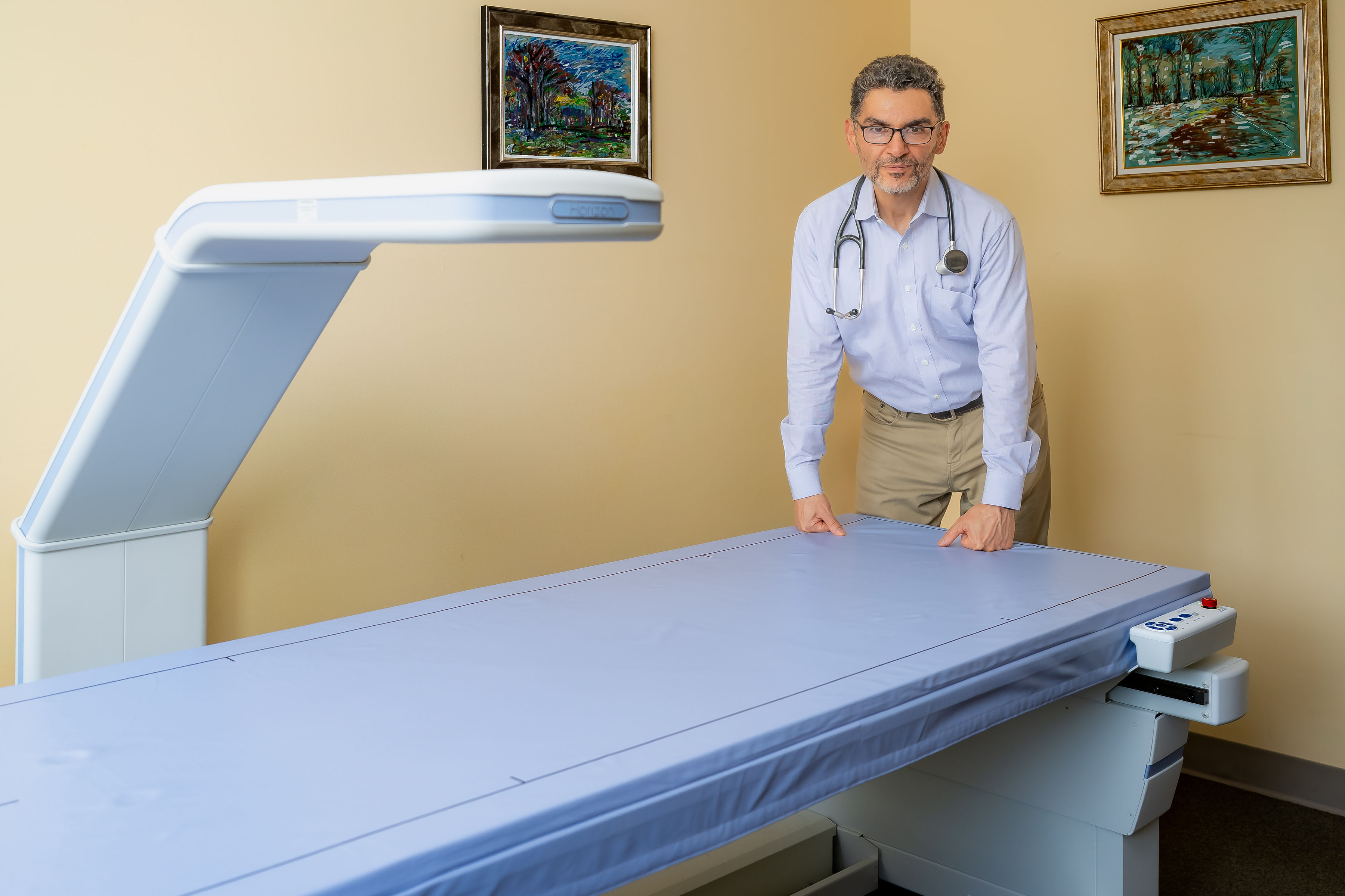 Dr. Asgari with DXA body composition scanner